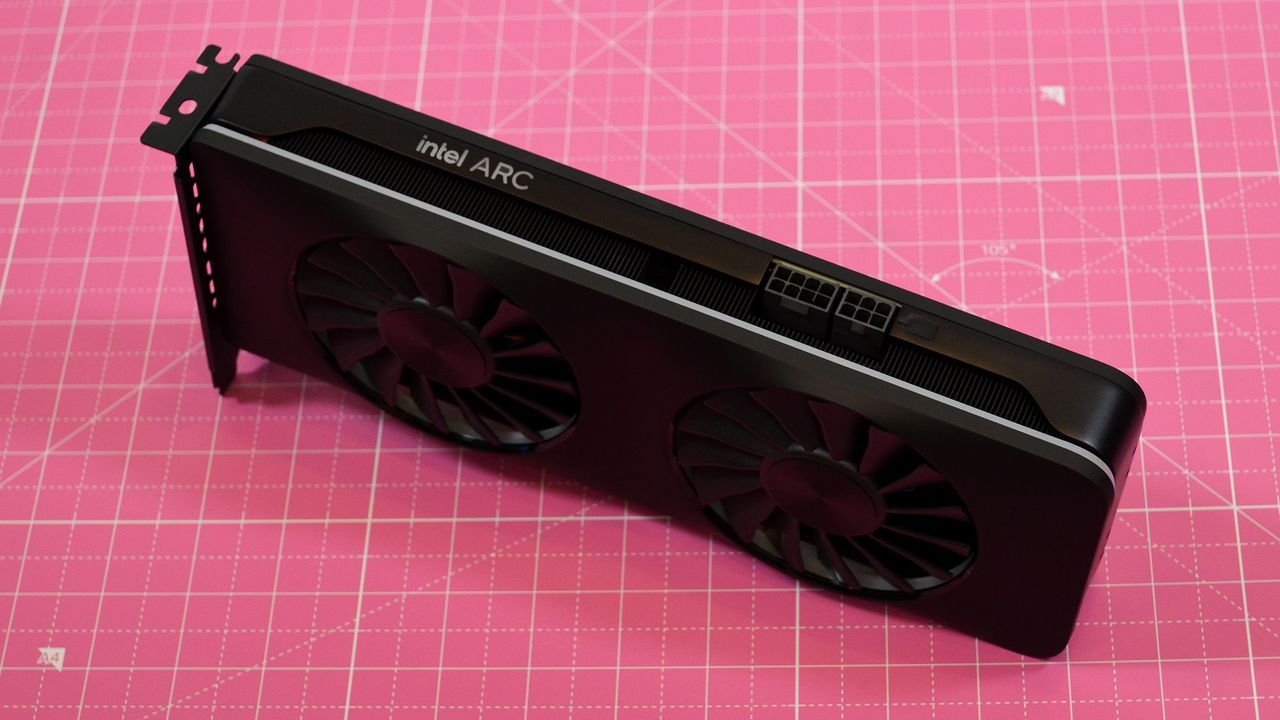 An Intel Arc A770 LE graphics card on a table with a pink desk mat