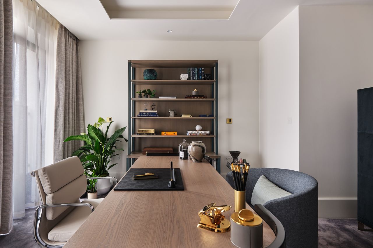 Wooden desk with brass accessories and shelves