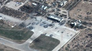 This satellite photo, taken on March 16, 2022 by Maxar Technologies' GeoEye-1 satellite, shows destroyed Russian helicopters at Kherson airfield in Ukraine.