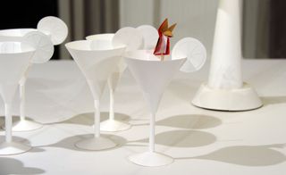 A detailed look at martini glasses constructed from paper stock.