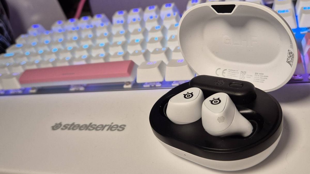 Photo of the SteelSeries Arctis Game Buds on a white desk.