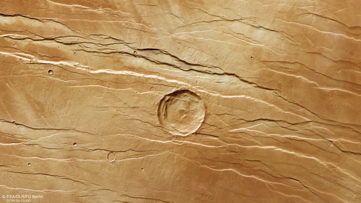 An overhead view of Tantalus Fossae, associated with Alba Mons, on the Martian surface. The image is based on data from the European Space Agency Mars Express mission.