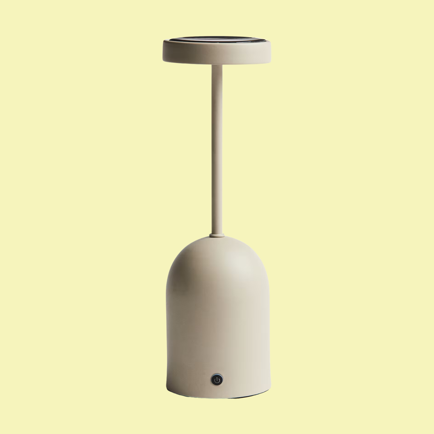 A light beige solar-powered table lamp