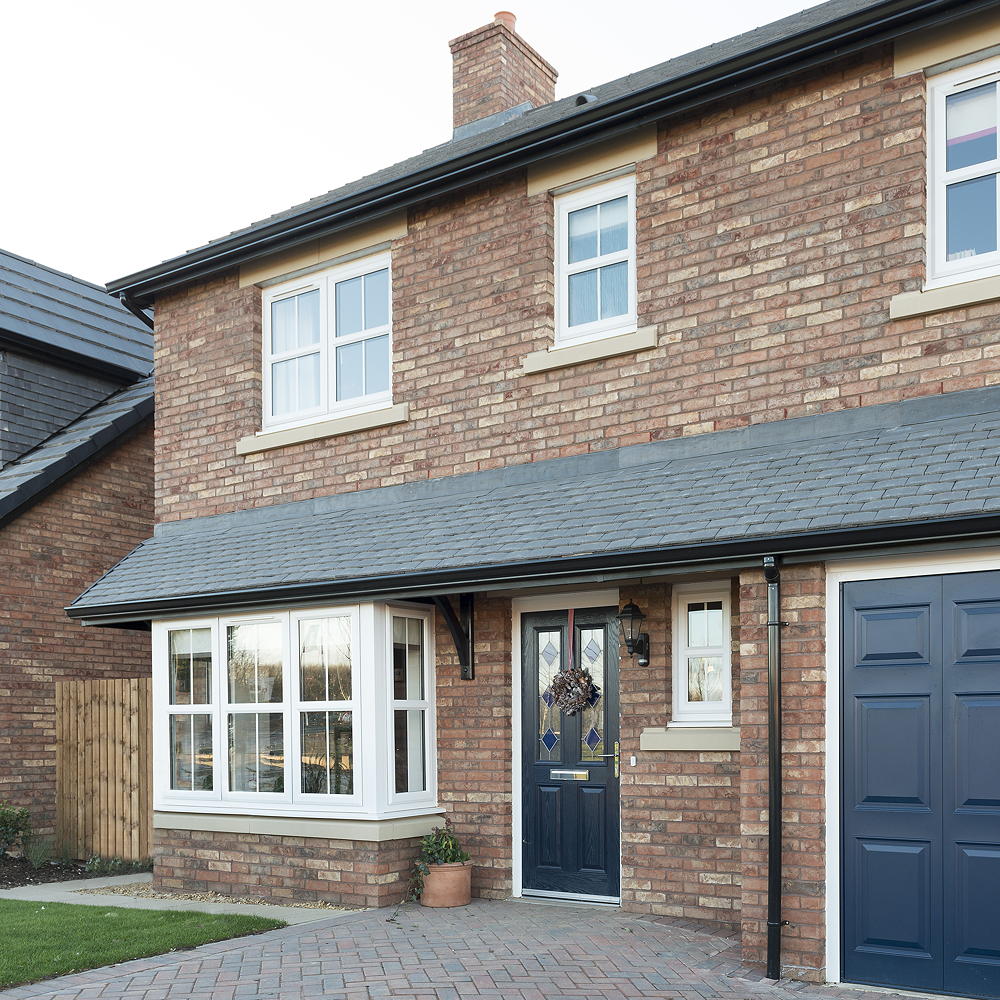 sloping roof house with exposed brick walls