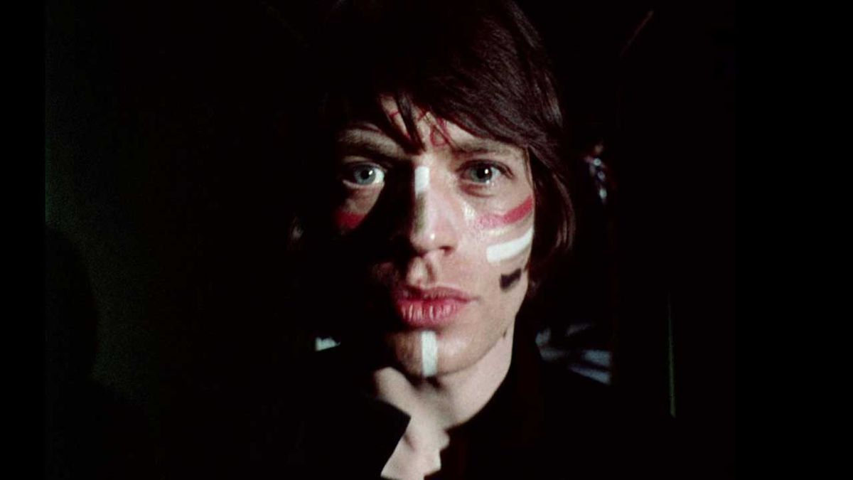 Mick Jagger wearing make-up