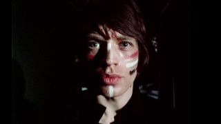 Mick Jagger wearing make-up
