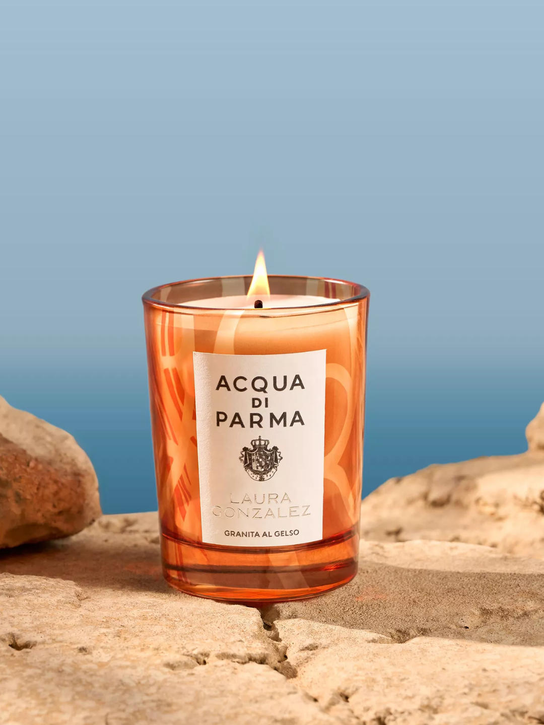An orange scented candle by Acqua di Parma