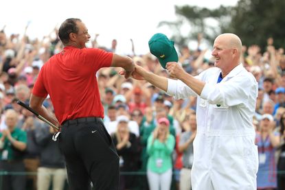 Tiger Woods and Joe LaCava celebrate on the 18th green