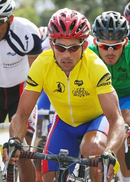 Local rider Arnold Alcolea remains composed in the leader's jersey during the final stage.