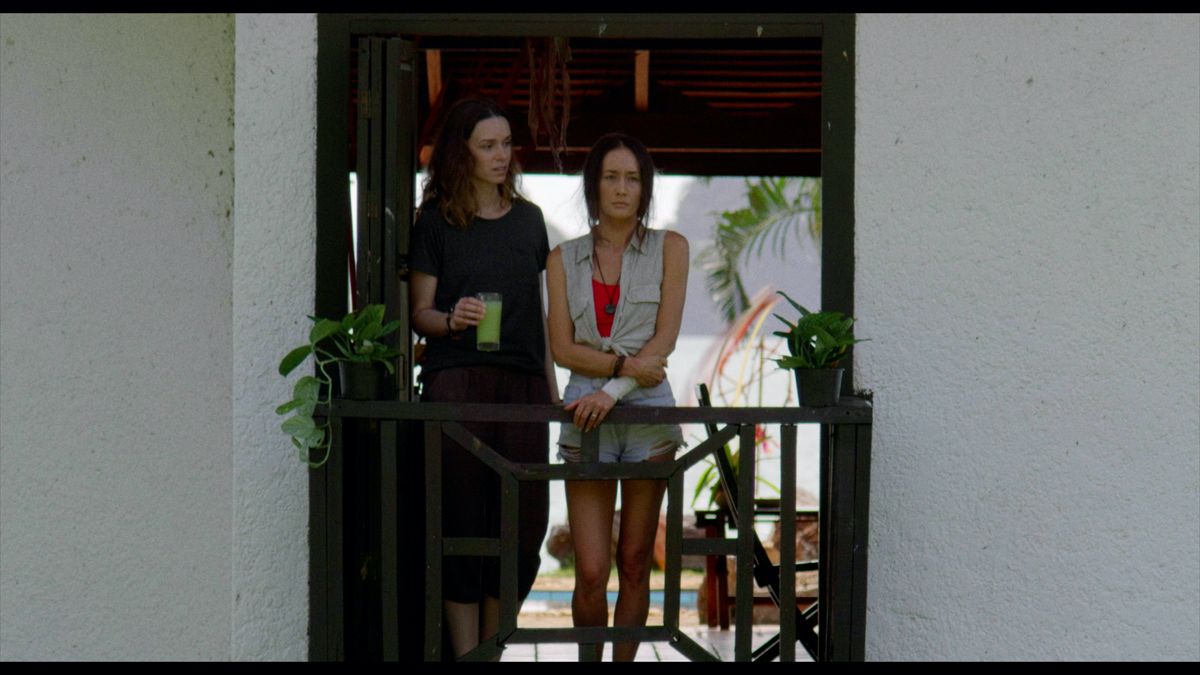 Samantha (Alex Essoe) brings Christine (Maggie Q) a smoothie after a traumatic night in Darren Lynn Bousman&#039;s &#039;Death Of Me&#039;.