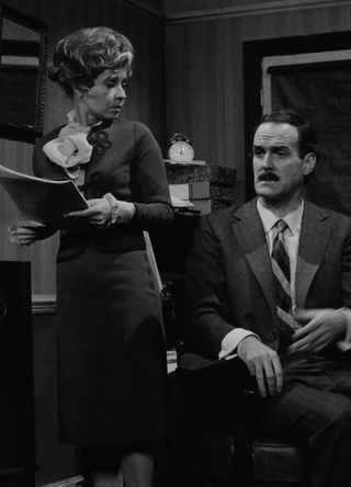 Prunella Scales and John Cleese.