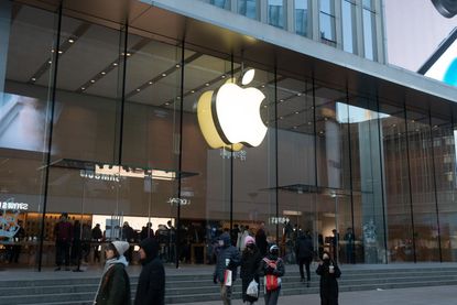 Citizens are walking past an Apple store in Shanghai, China.