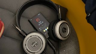 Grado SR325x headphones with a Sony Walkman on a cushion