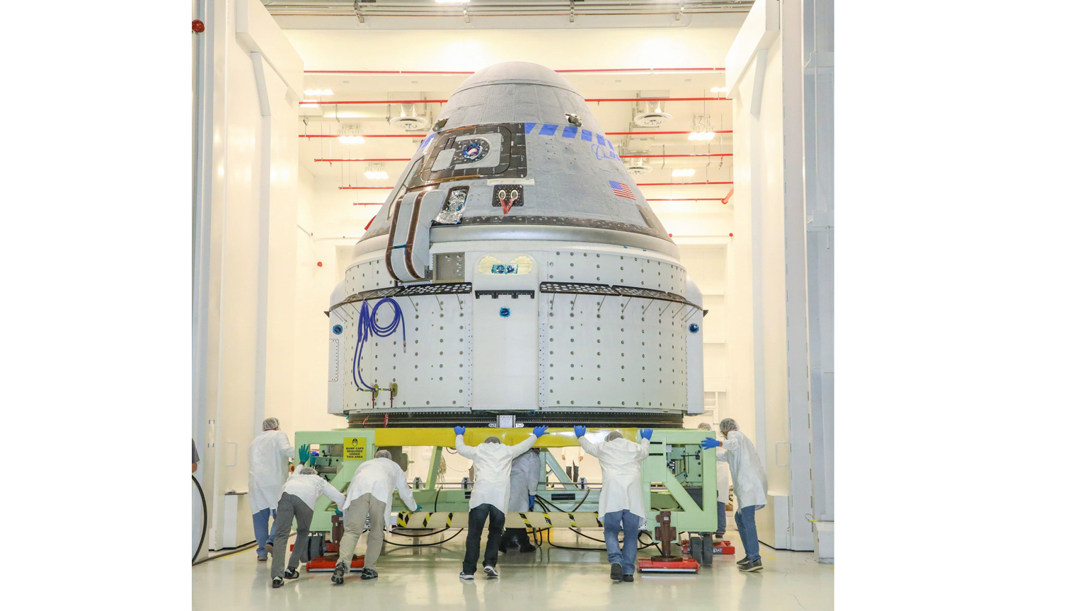 Boeing engineers prepare a CST-100 Starliner crew capsule for a critical pad abort test on Nov. 4, 2019 at the White Sands Missile Range in New Mexico. 