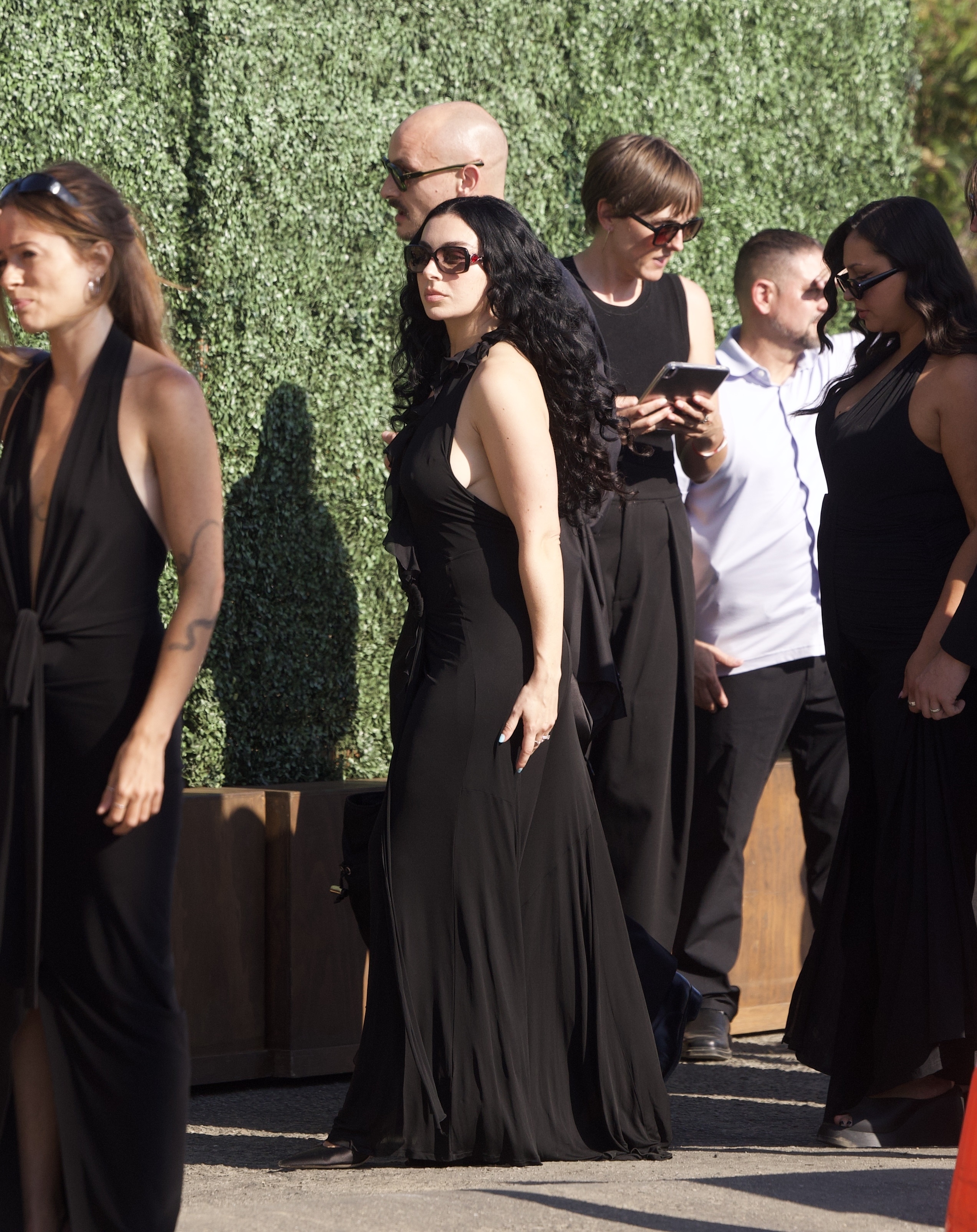 Charli XCX wears a little black dress to attend Matty Healy and fiancée Gabbriette Bechtel's wedding in Los Angeles