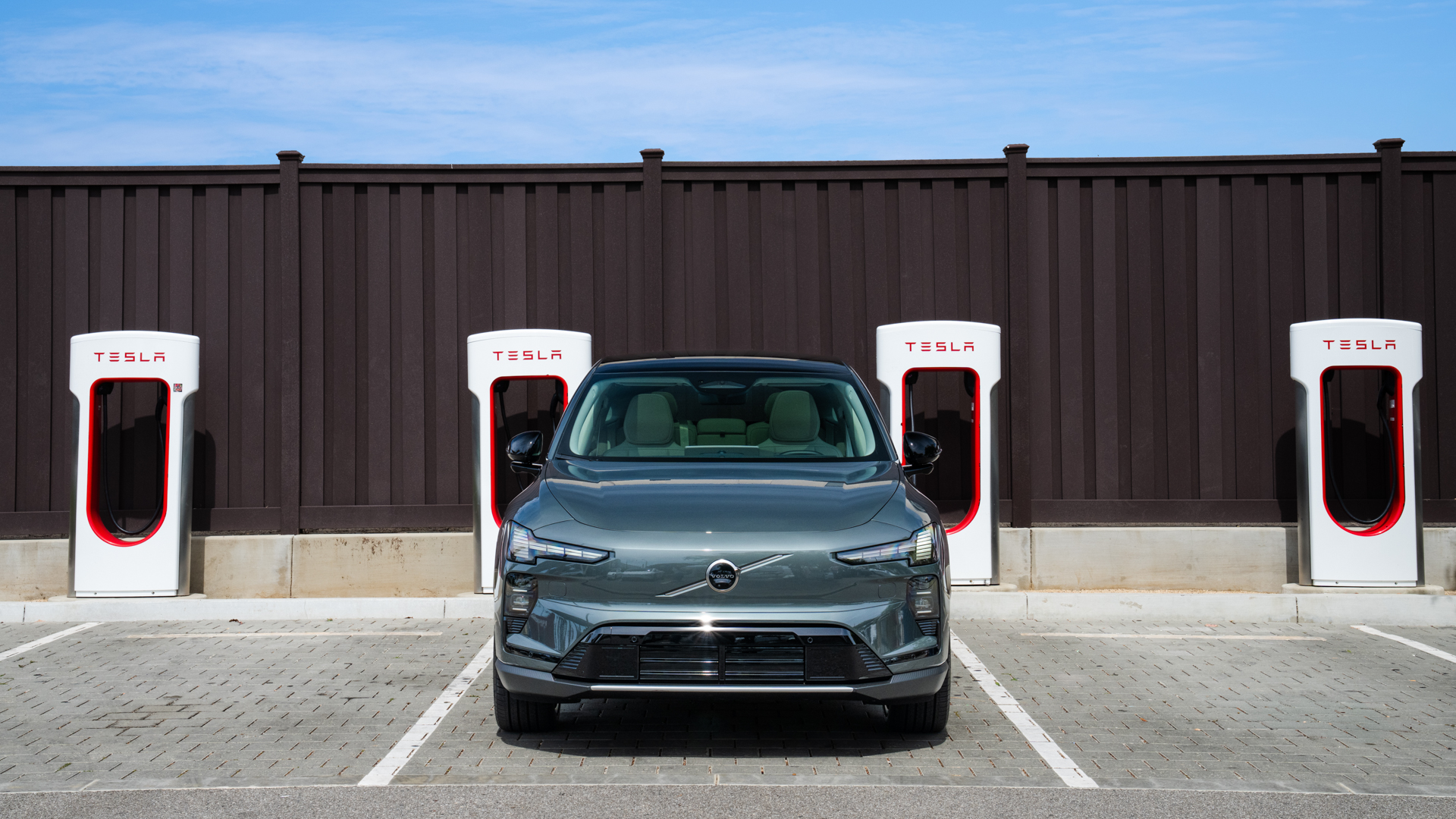 Volvo EX60 at Tesla Supercharger