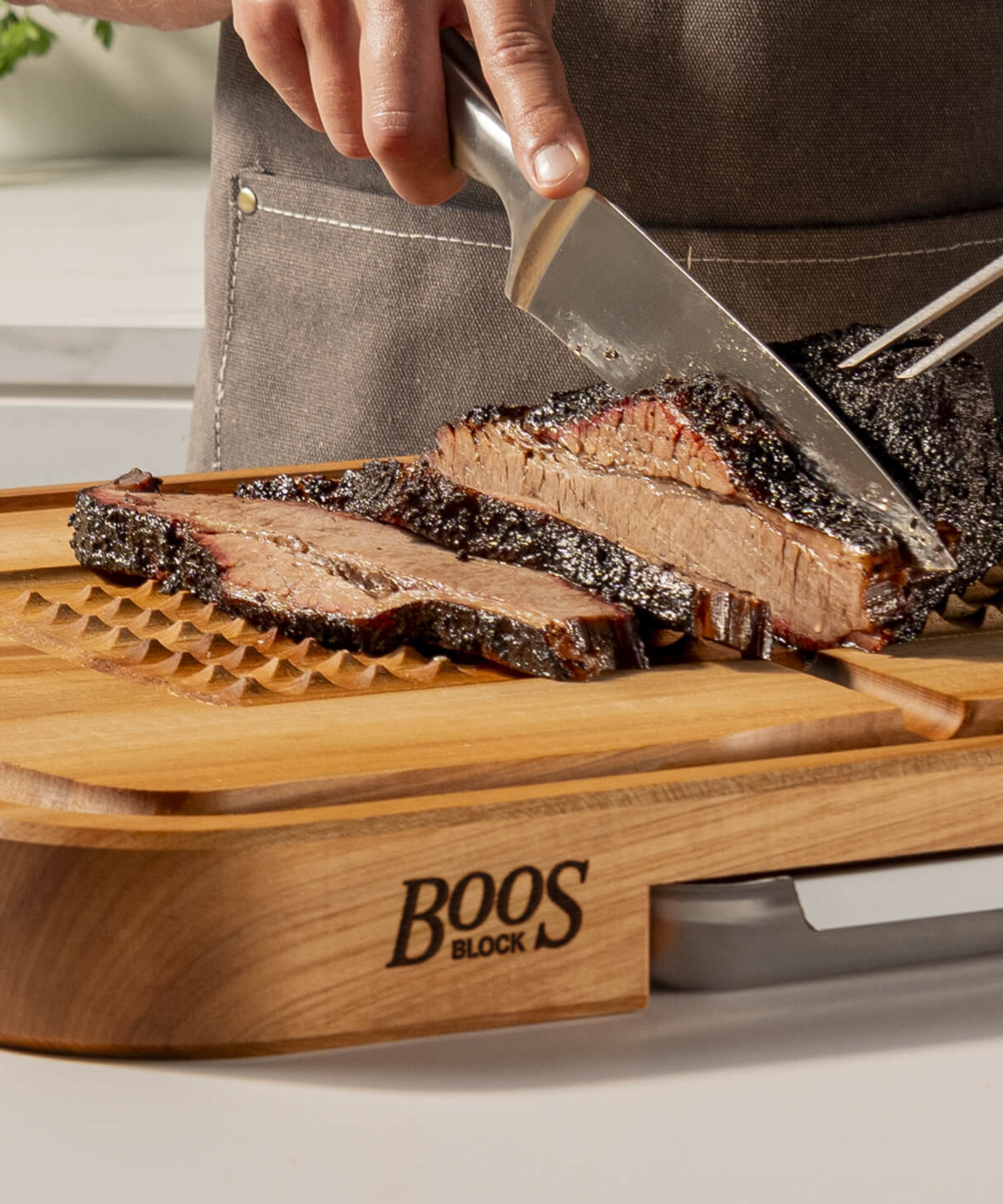 Slicing steak on a John Boos & Co Chopping Block