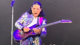 Corey Feldman playing electric guitar