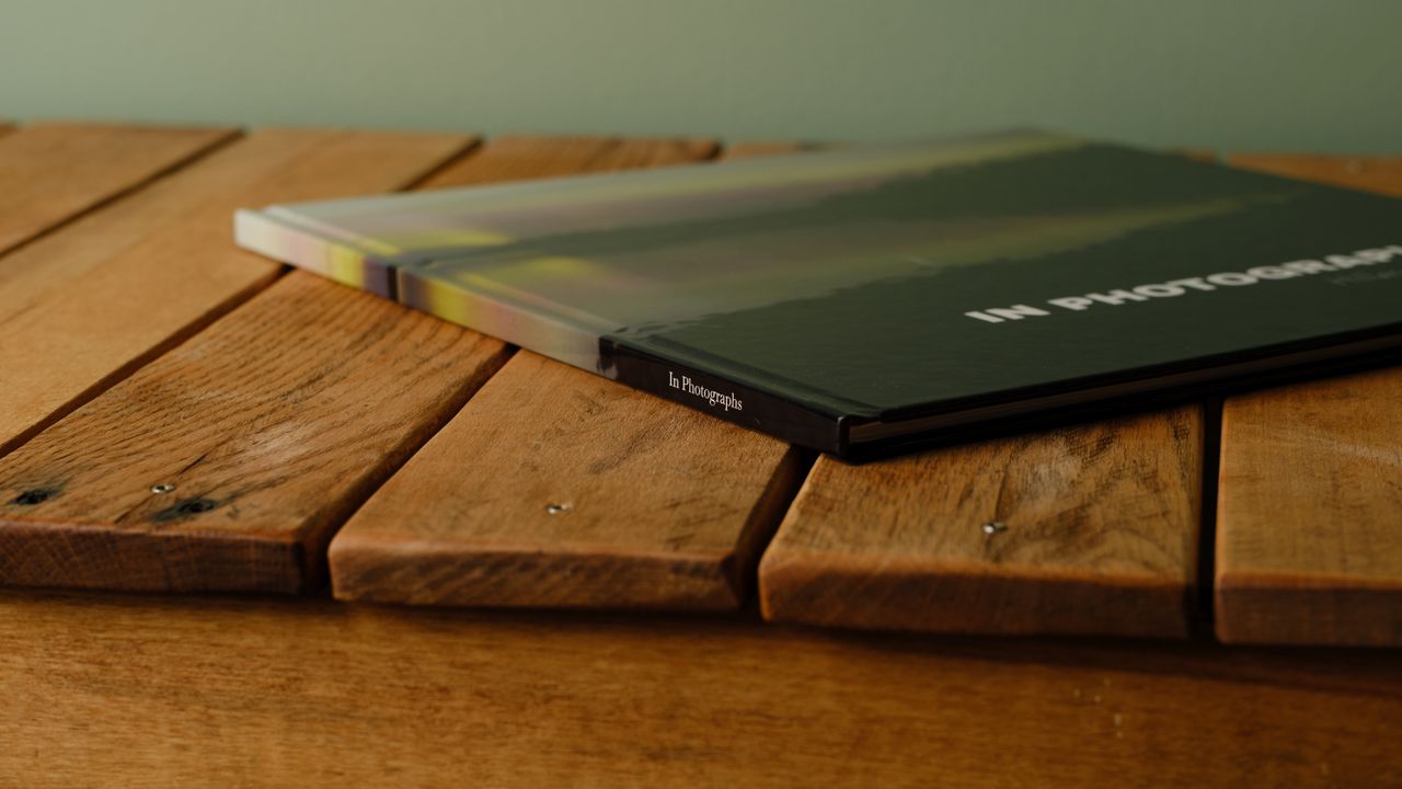The Whitewall coffee table photo book on a desktop