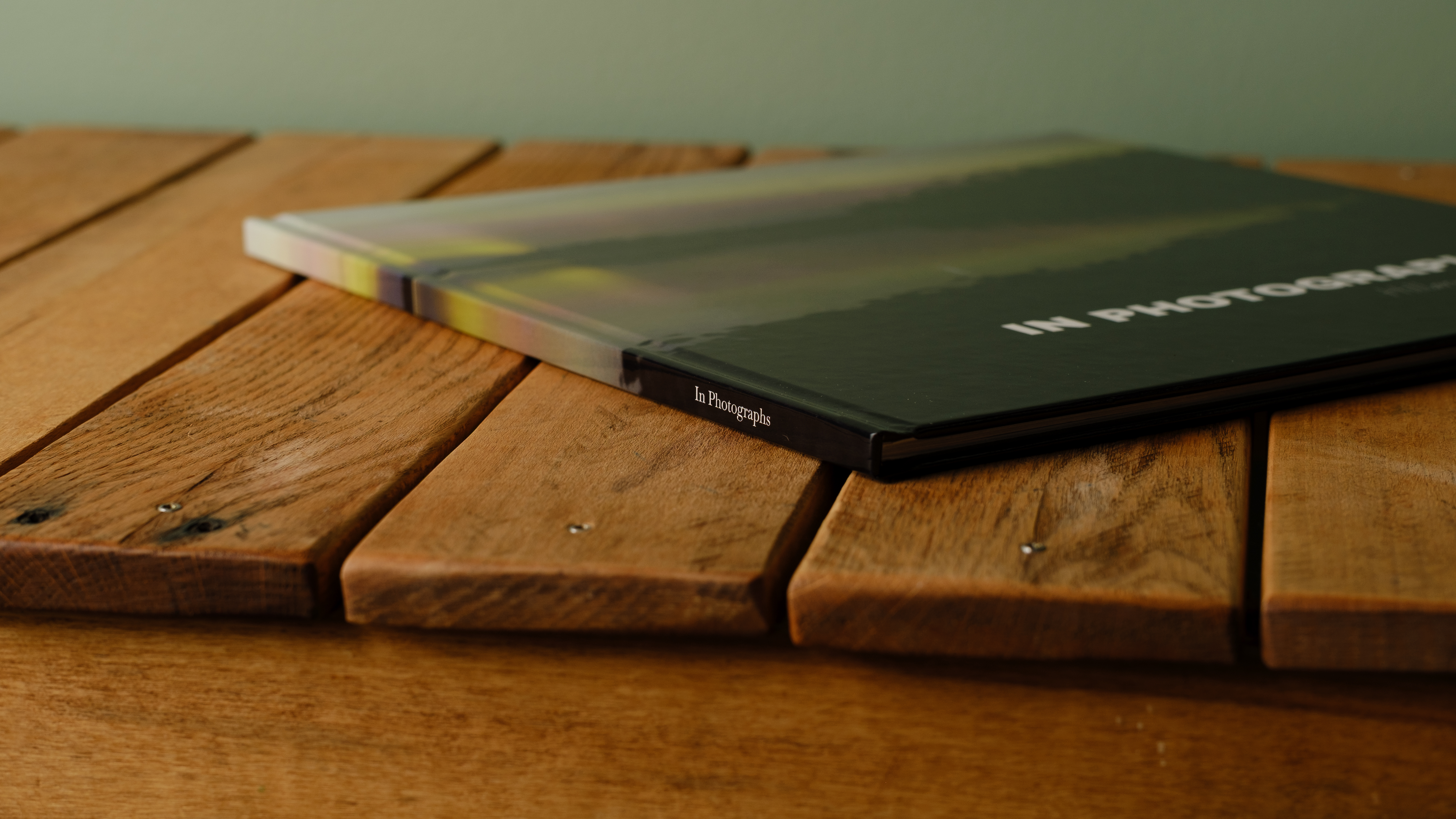 The Whitewall coffee table photo book on a desktop