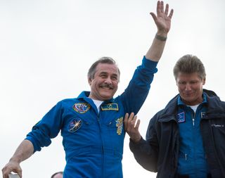 Expedition 36 Commander Pavel Vinogradov Waves to Crowd