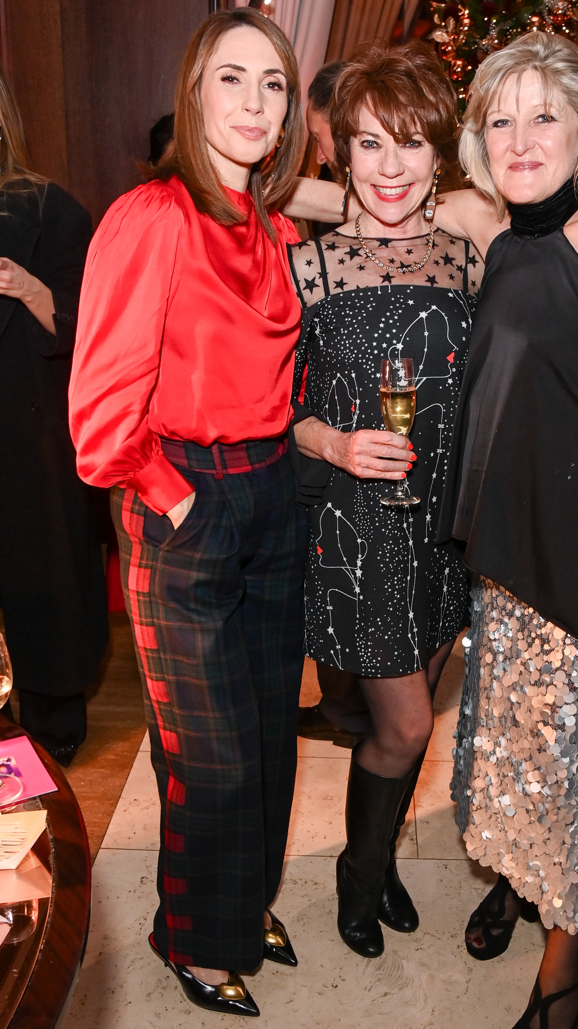 Alex Jones, Kathy Lette and Amanda Ross attend the annual 45 Park Lane Christmas Tree Switch On on November 19, 2025 in London