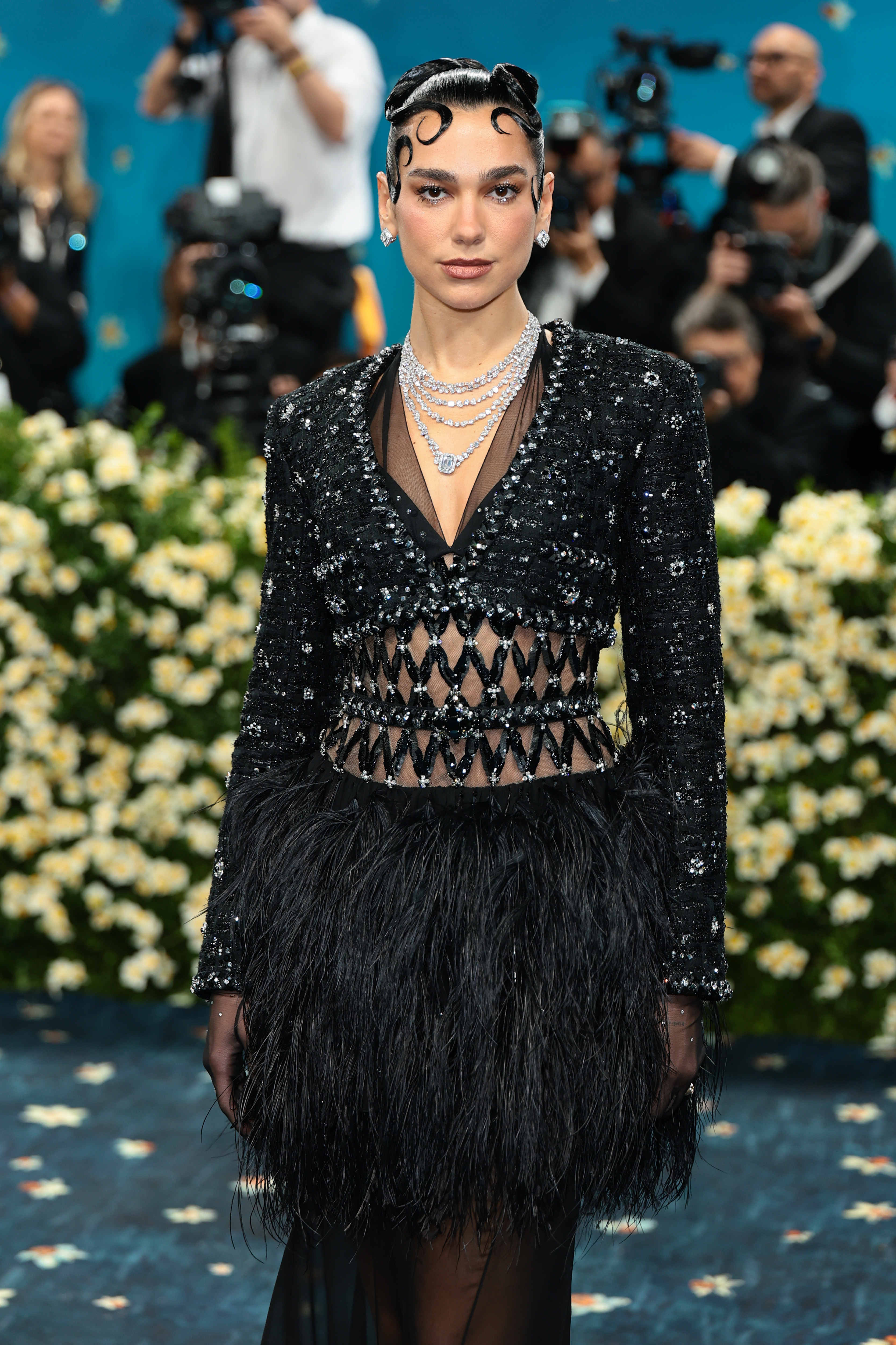 Dua Lipa wearing a kiss curl updo