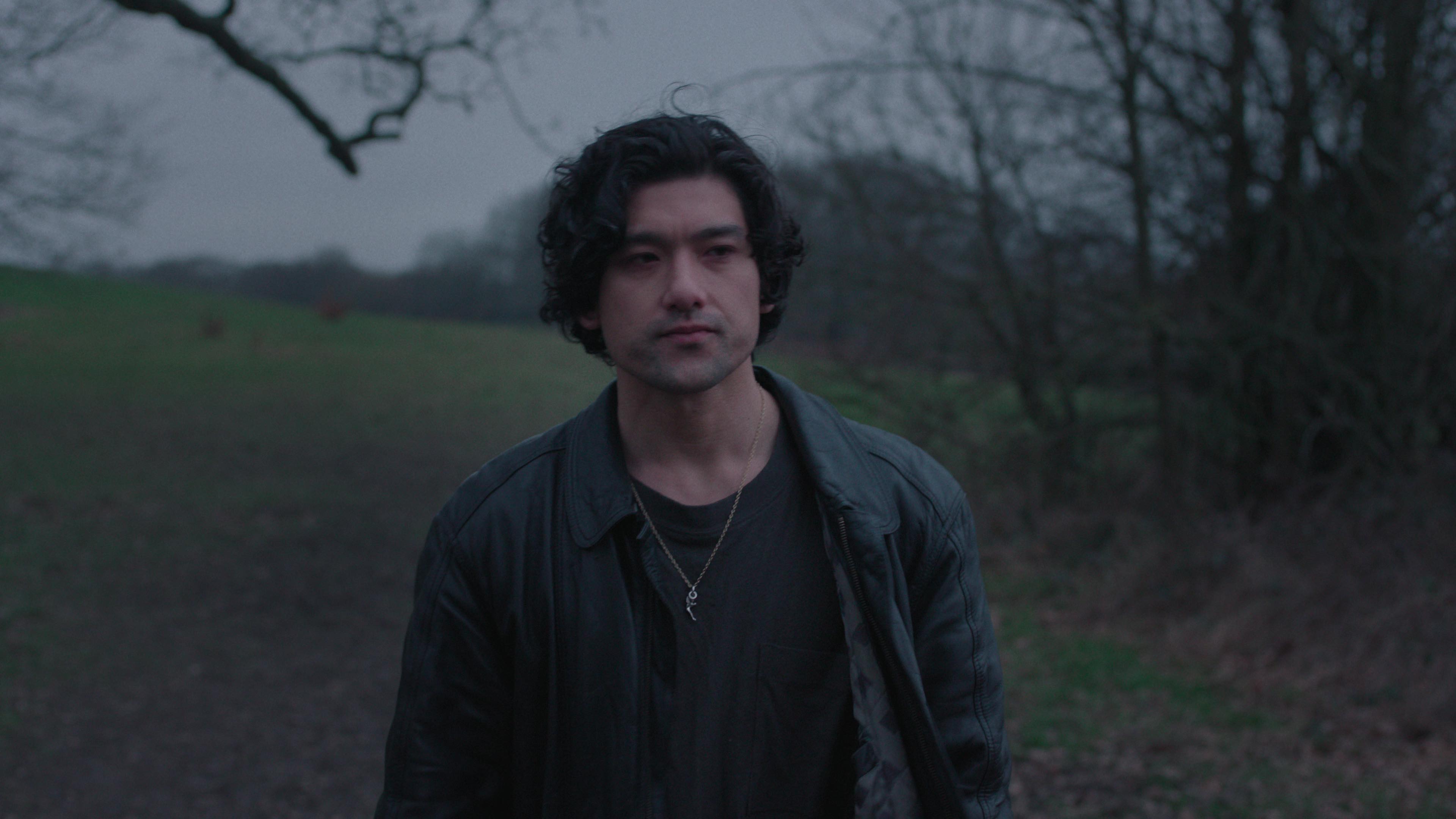 will sharpe as felix walking through the english country side at dark in too much