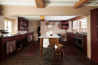 a traditional kitchen with an heirloom island