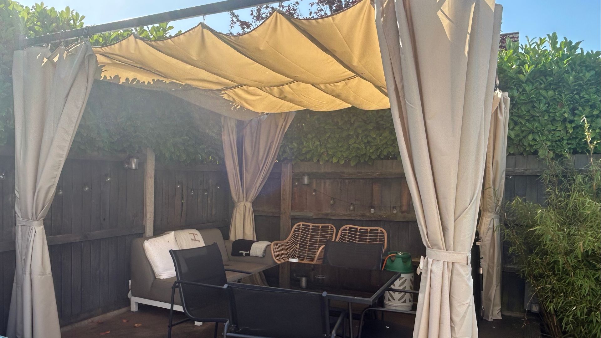 Pergola on decking with furniture underneath