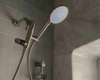 Hai Smart Shower Head in review in Melissa's gray bathroom in light blue