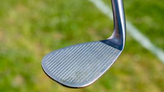 The face and leading edge of a golf wedges