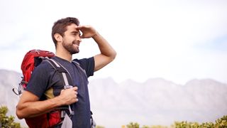 Shot of a man enjoying a hike on a sunny day