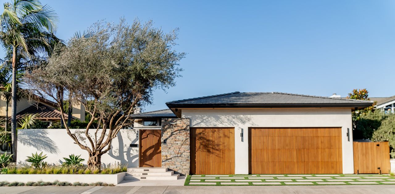 Modern driveway with wooden slat doors