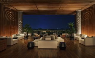 Living area with soaring wood-lined ceiling in the hotel sanya edition