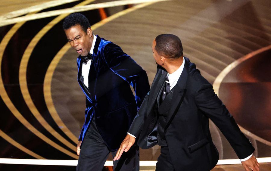 Will Smith slaps Chris Rock onstage during the show at the 94th Academy Awards