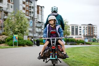 One of the best cargo bikes is a long tail design as shown in this image which allows the rider to take passengers at the rear of the bike