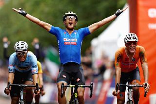 Matteo Trentin opens his arms after a perfect ride by the Italian team