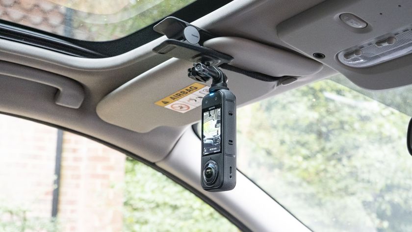 Insta360 X5 mounted to the Flexi Clip, attached to a car&#039;s sun shield