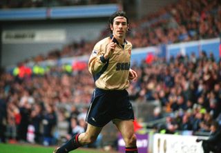 Robert Pires celebrates a goal for Arsenal against Aston Villa in March 2002.