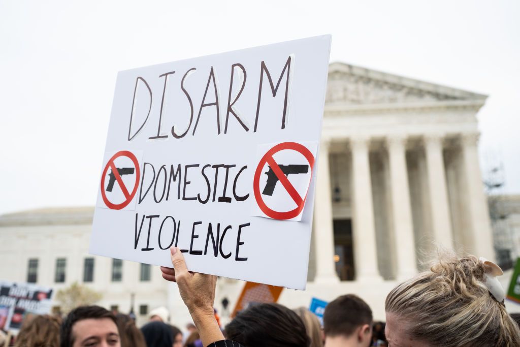 Activists rally outside the U.S. Supreme Court before the start of oral arguments in the United States v. Rahimi second amendement case in Washington