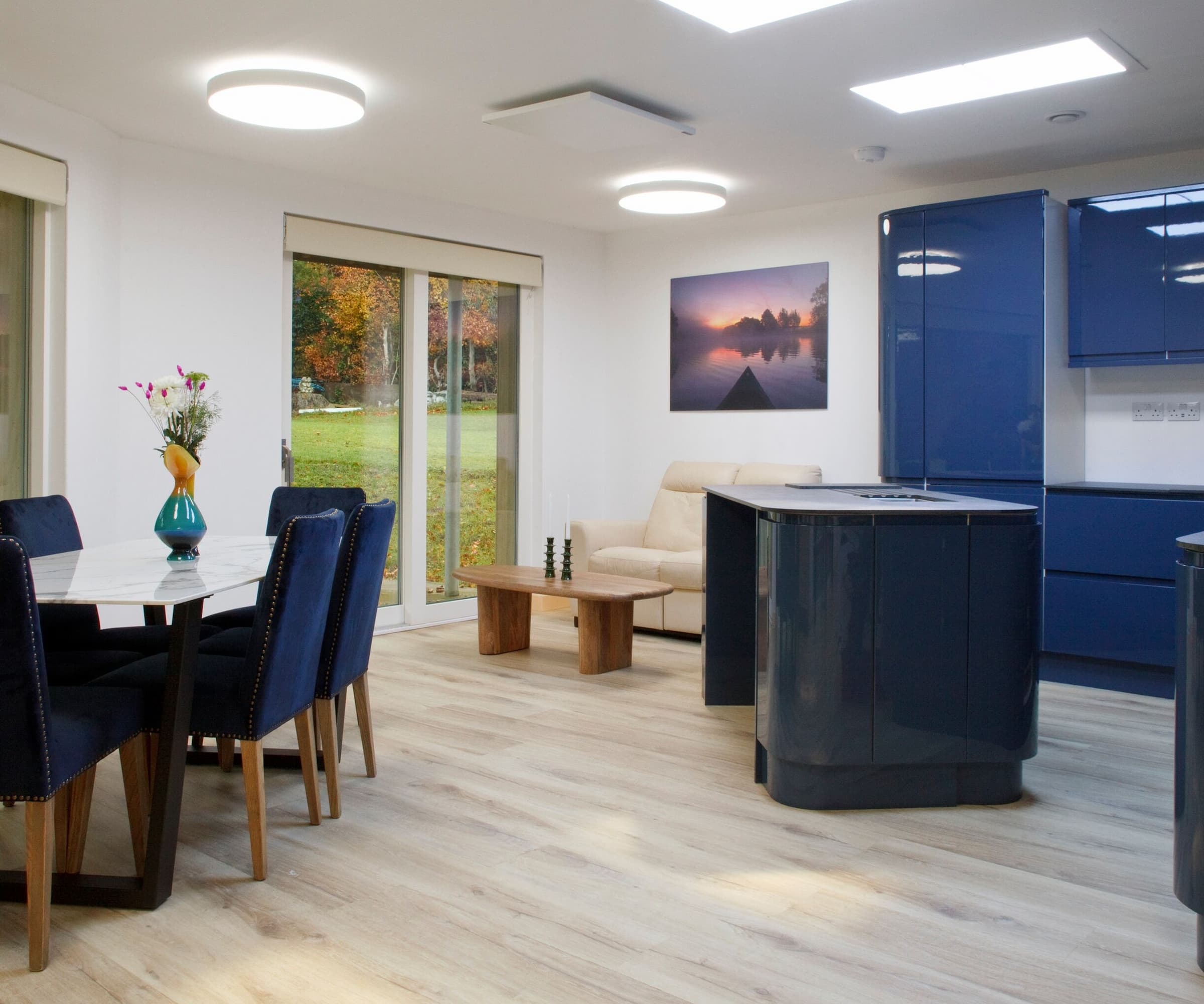 A ceramic blue kitchen with wooden floorboards