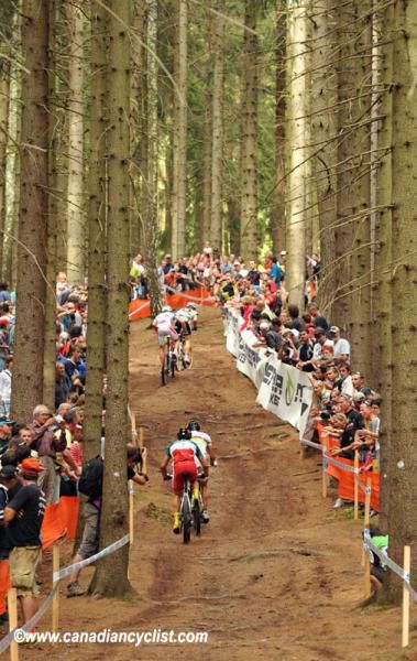 Riders make their way through the forest and a huge crowd (Nove Mesto Na Morave World Cup, Cze)