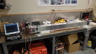 The innovative IceMole drill built for melting through glacier ice on Saturn's icy moon Enceladus is seen on workbench. The tool was used to successfully drill into the Blood Falls glacier in Antarctica during a test run.