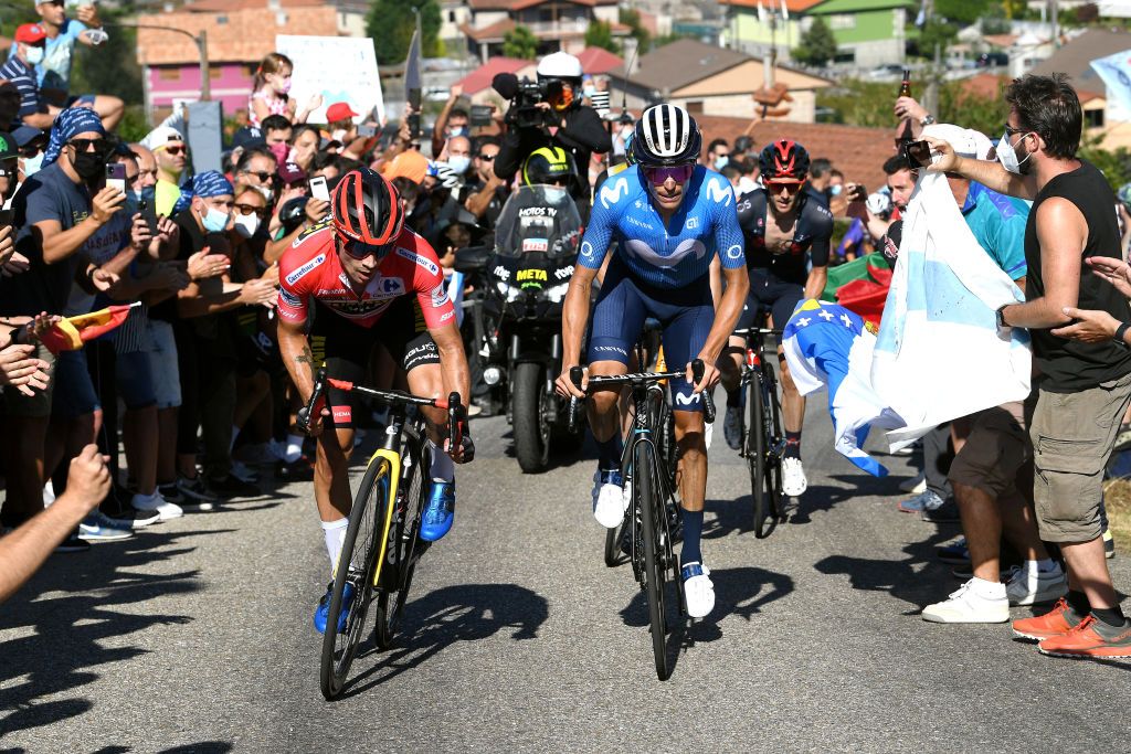 MOS SPAIN SEPTEMBER 04 LR Primoz Roglic of Slovenia and Team Jumbo Visma red leader jersey and Enric Mas Nicolau of Spain and Movistar Team attack in the breakaway during the 76th Tour of Spain 2021 Stage 20 a 2022km km stage from Sanxenxo to Mos Alto Castro de Herville 502m lavuelta LaVuelta21 on September 04 2021 in Mos Spain Photo by Tim de WaeleGetty Images
