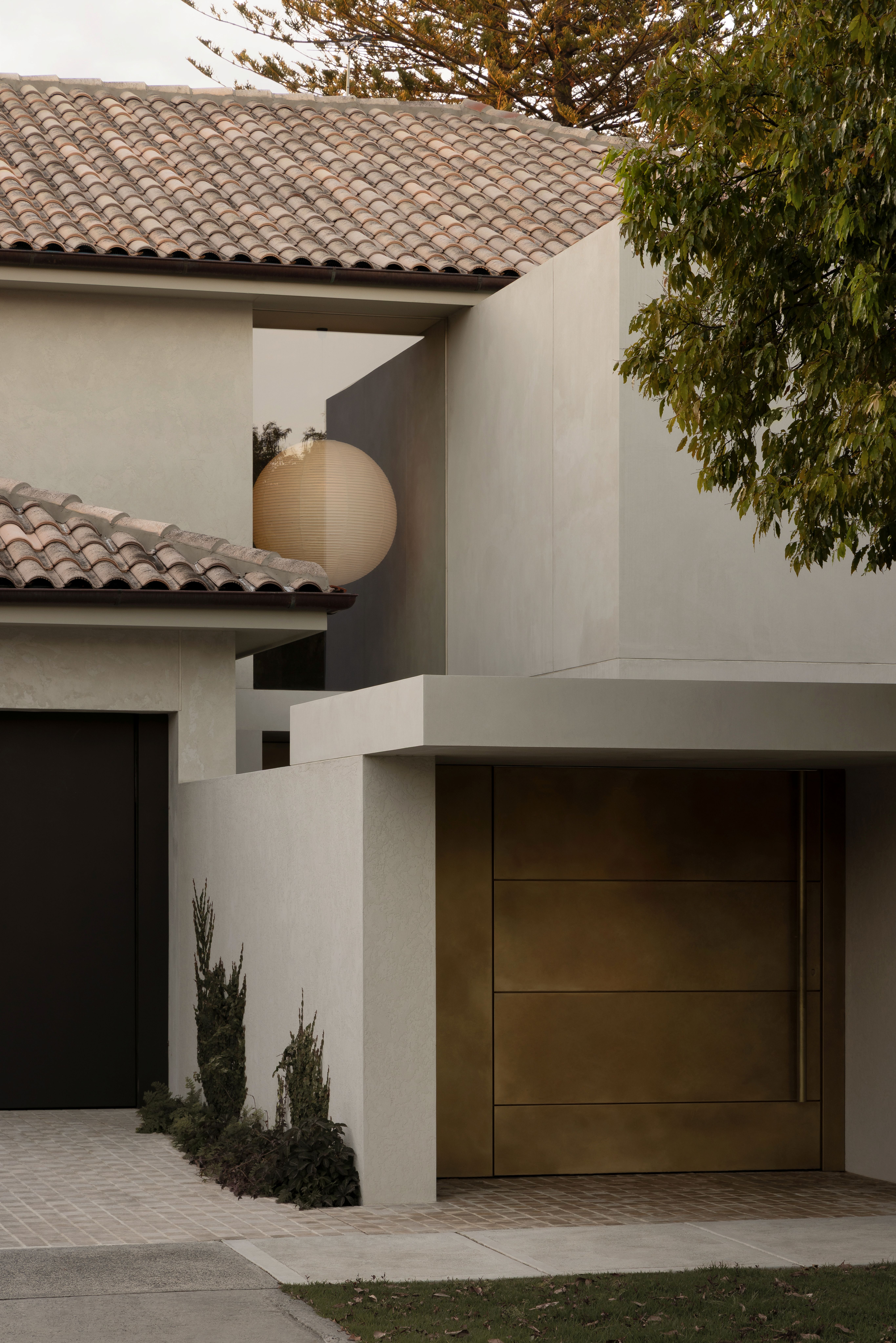 Front of white rendered home