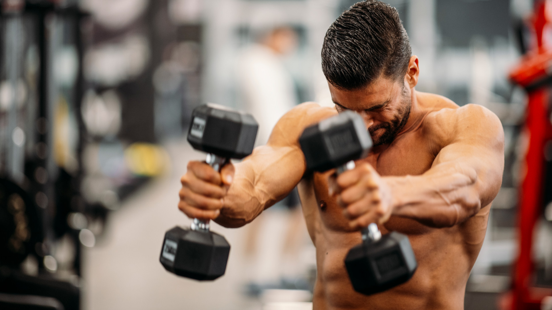 A man performing front raises