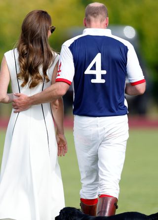 Prince William with his arm around Kate Middleton