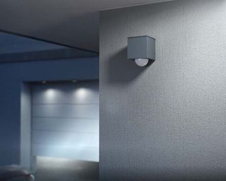 Motion sensor and presence detector lights by Gira placed on the outside of a house