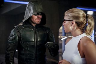 Stephen Amell and Emily Bett Rickards as the Green Arrow and Felicity Smoak.